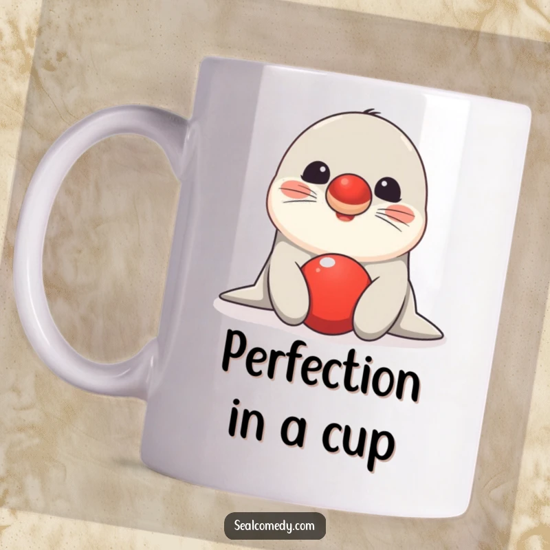 Funny seal mug showing a happy sea creature skillfully balancing a bright red ball on its nose with a cheerful expression.