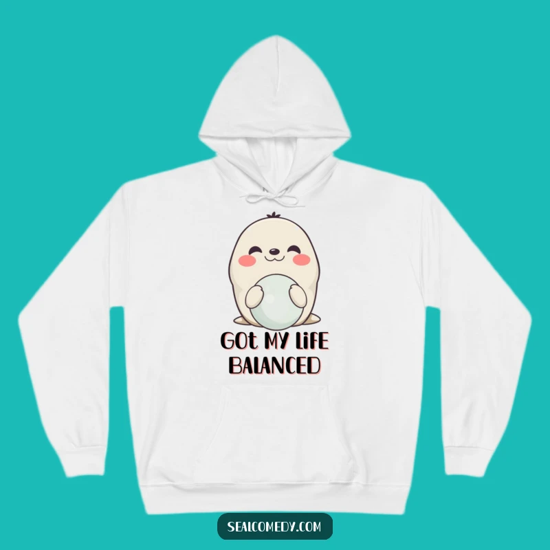 Cozy Funny Smiling Seal Balancing Hoodie: Warmth and Wonder!