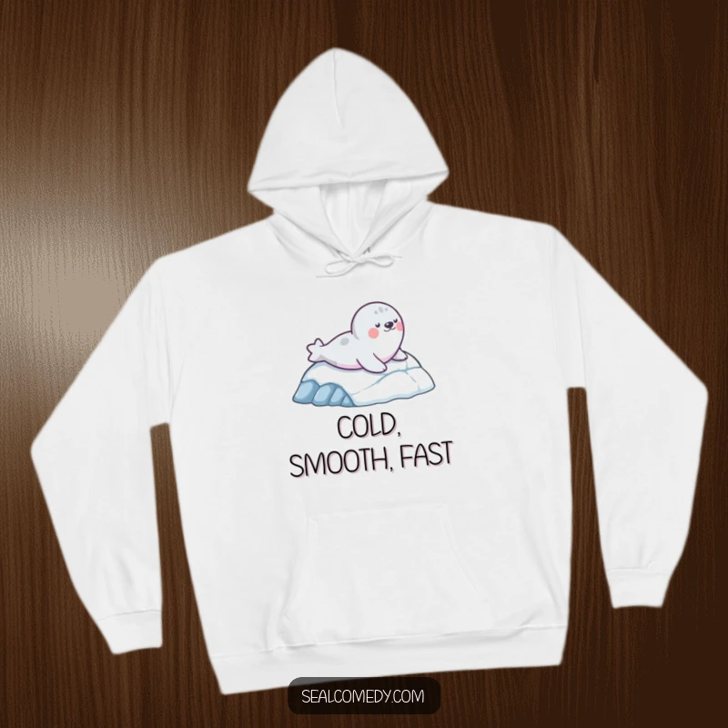 Funny hoodie featuring a seal character having a blast sliding down an icy slope, perfect for cozying up after winter fun.