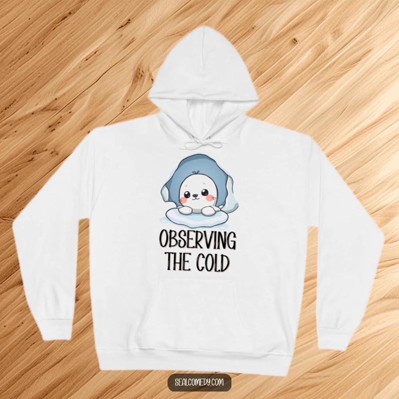 Funny hoodie featuring a seal character peeking out from an ice hole, symbolizing cozy curiosity and a love for discovery.