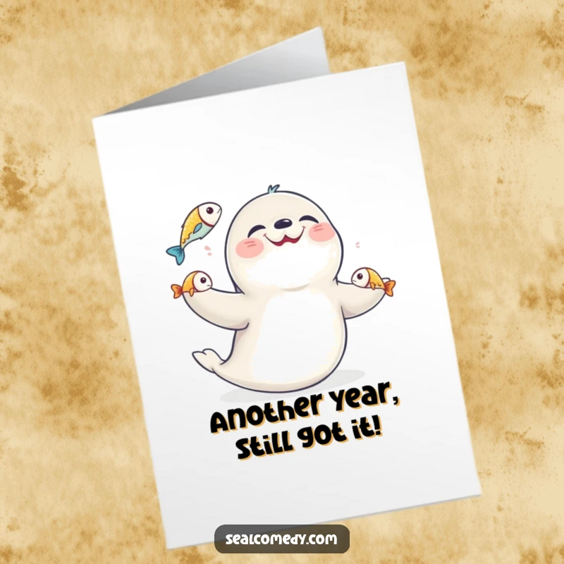 Funny Free Printable Birthday Card showing a seal with a huge smile, expertly juggling three shiny fish.