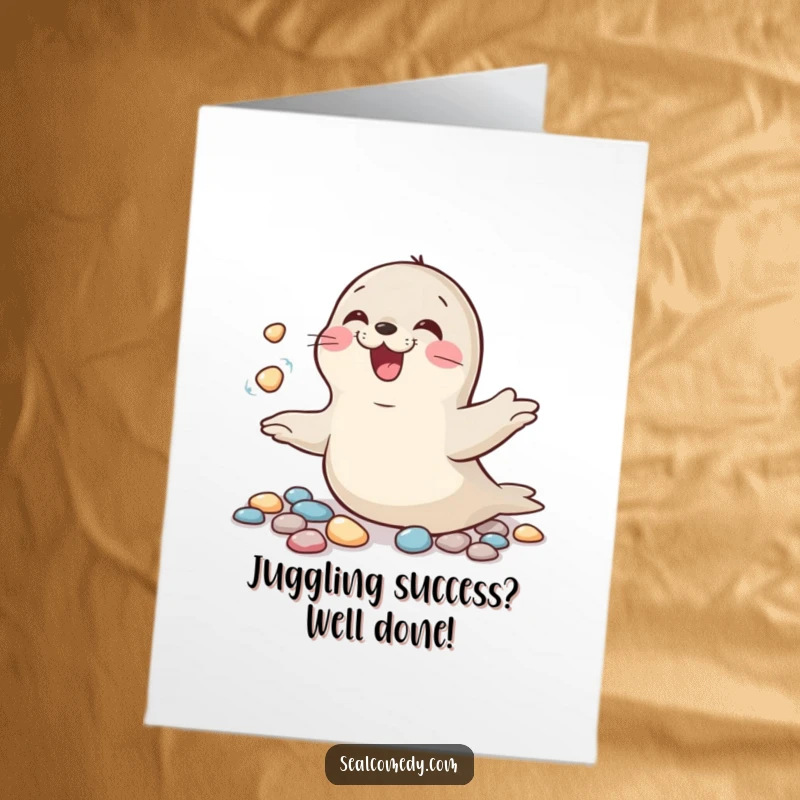 Funny free printable congratulations card: A seal giggling while juggling shiny pebbles, celebrating your impressive skills and hard-earned victory.