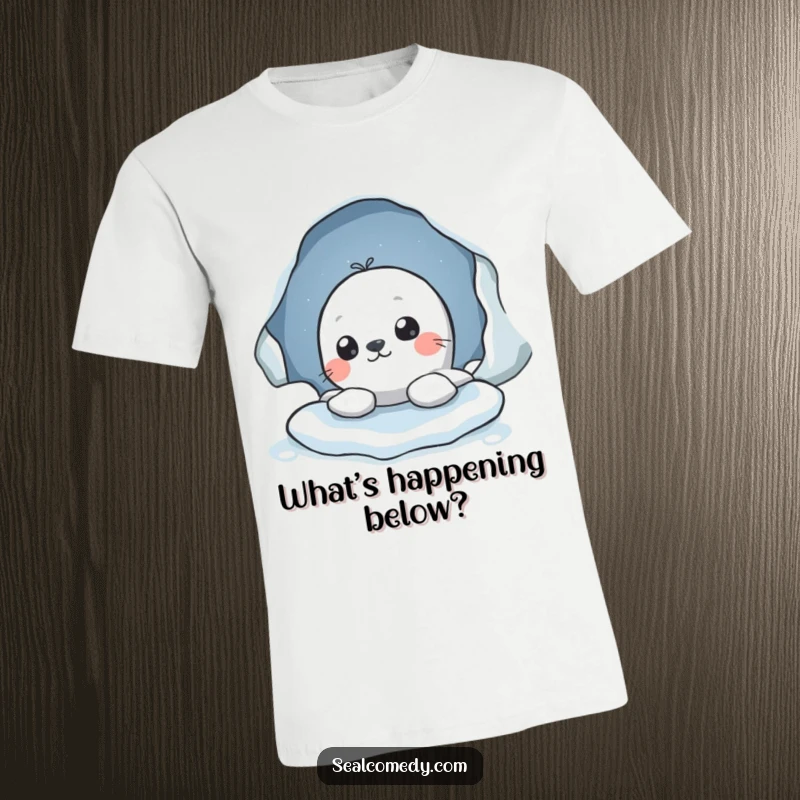 Funny t-shirt showing a seal character's head peeking curiously from an ice hole, highlighting a sense of wonder and observation.