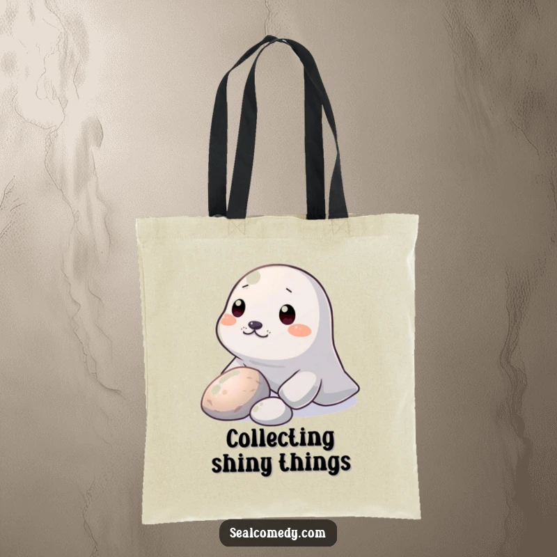 Funny Tote Bag: A seal nudges a shiny pebble with its snout, a humorous and charming accessory.