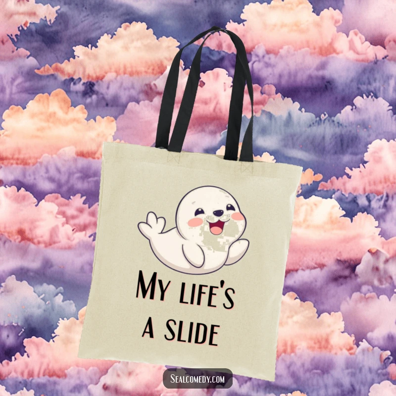Funny seal pup joyfully sliding on its belly with a delighted smile, showcased on a durable and fun tote bag.